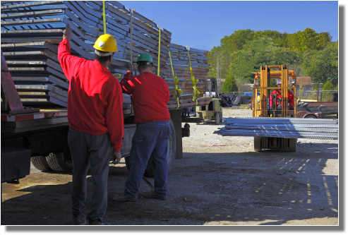 INI workmen loading customers truck